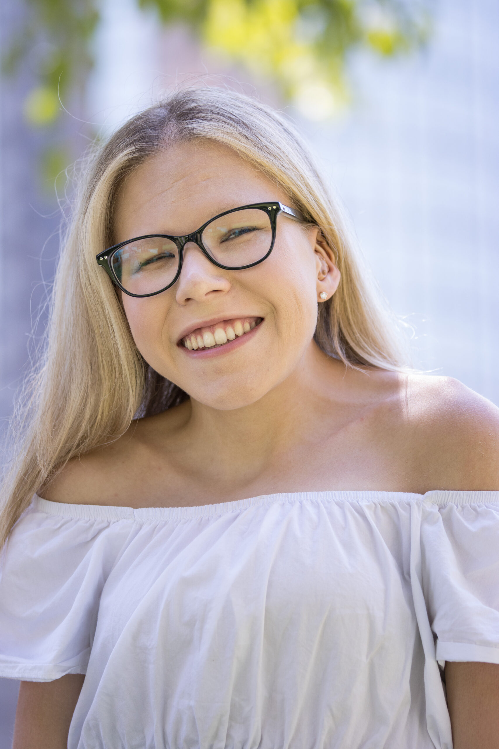 Professional Profile Head Shot of Cassidy Huff wearing black glasses